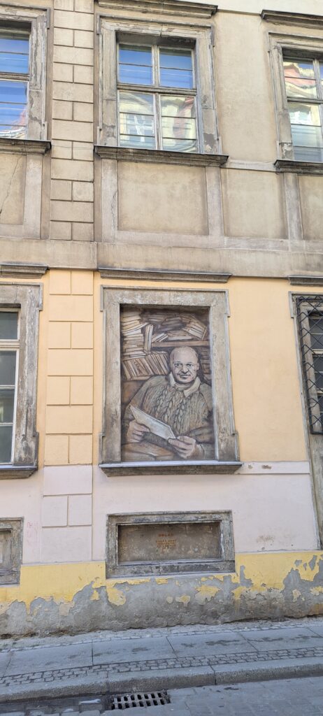 Wandbild, Mann mit Büchern